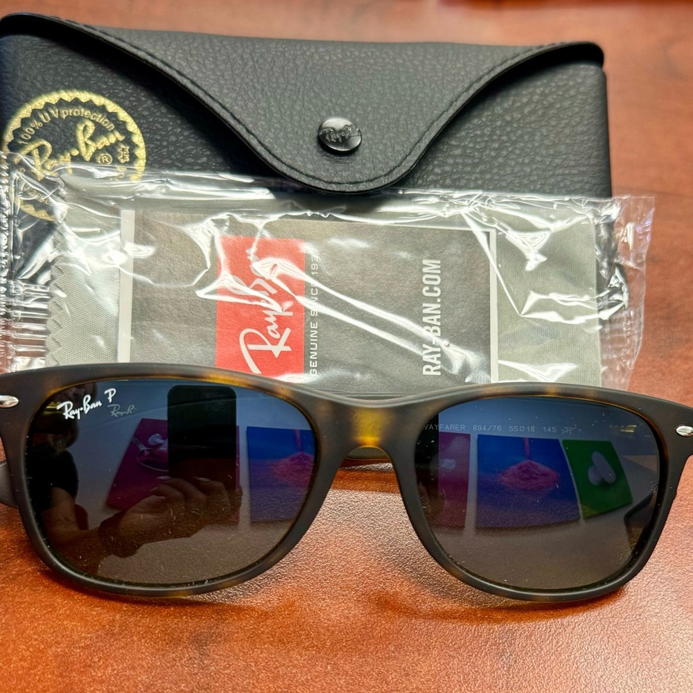 Brand New Polarized Rayban Wayfarers, mint condition.
